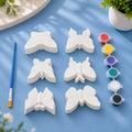 Butterfly Set — 6 white Plaster of Paris butterflies with paint pots and brush on light blue background