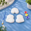 Gem Hearts Set — 3 white Plaster of Paris gem hearts with paint pots and brush on light blue background