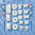 Mega Mix Plaster of Paris painting set — 16 figures with 2 paint strips and 2 brushes on light blue background