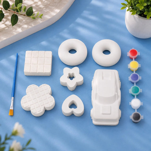Mixed Shapes Kit — white Plaster of Paris chocolate, donut, star and car figures with paint strip on light blue background