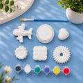 Plane & Cookies Mix Kit — 6 white Plaster of Paris figures with paint pots and brush on light blue background