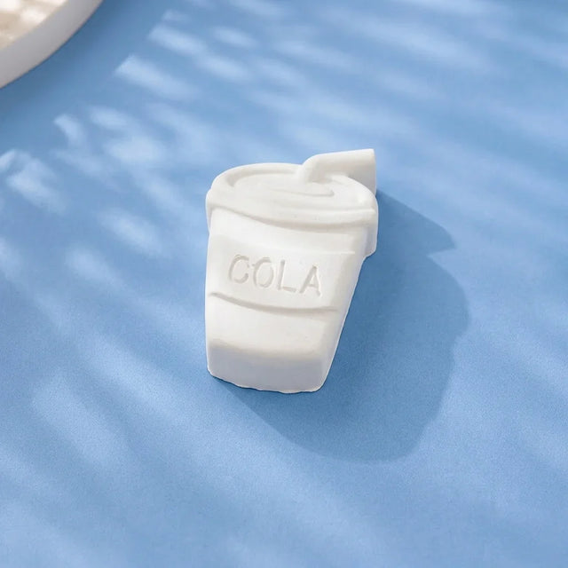 Cola cup medium ready-to-paint plaster figure on blue background