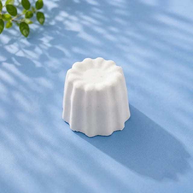 Mini bundt small ready-to-paint plaster figure on blue background